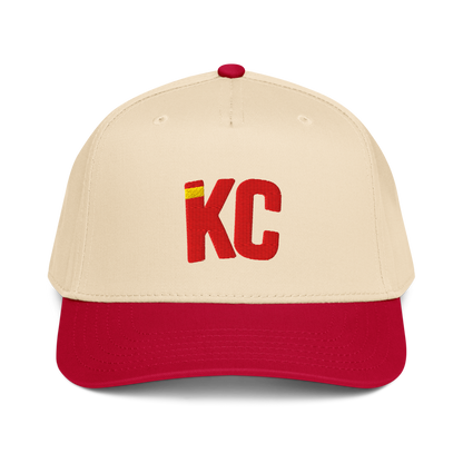 Beige and red baseball cap with 'KC' logo on a white background