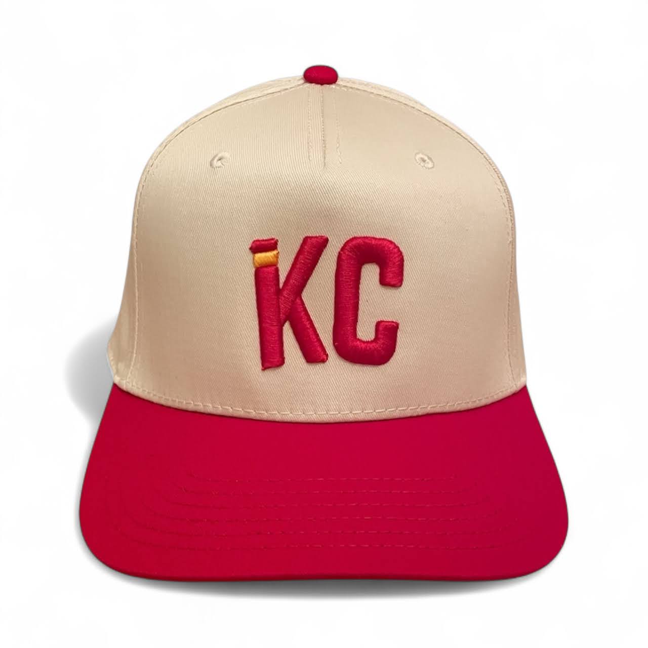 Beige and red cap with 'KC' embroidery on a white background