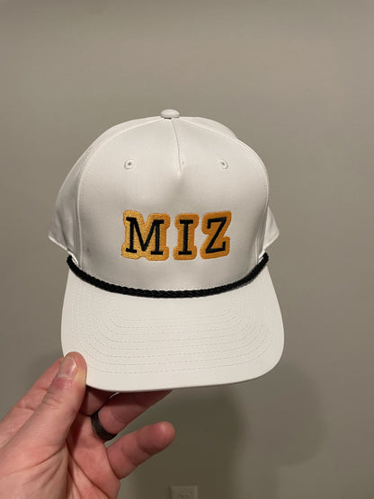 white gold and black rope hat